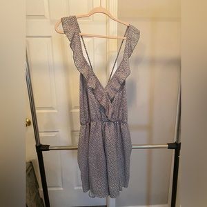 Green floral romper with cross cross back